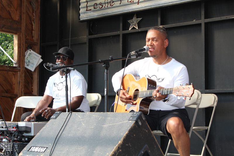 Two members performing as an acoustic duo