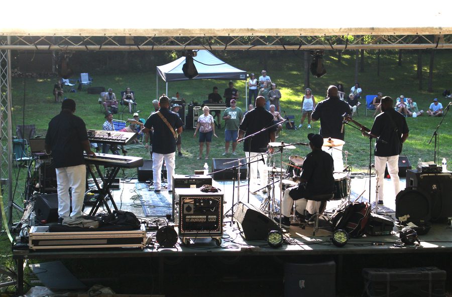 The band performing on a festival main stage