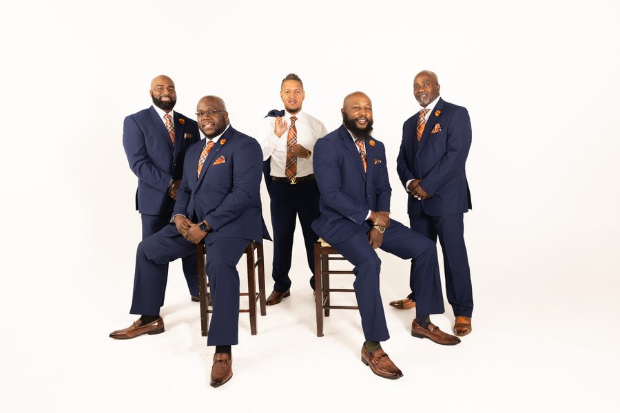 The group in matching blue suits